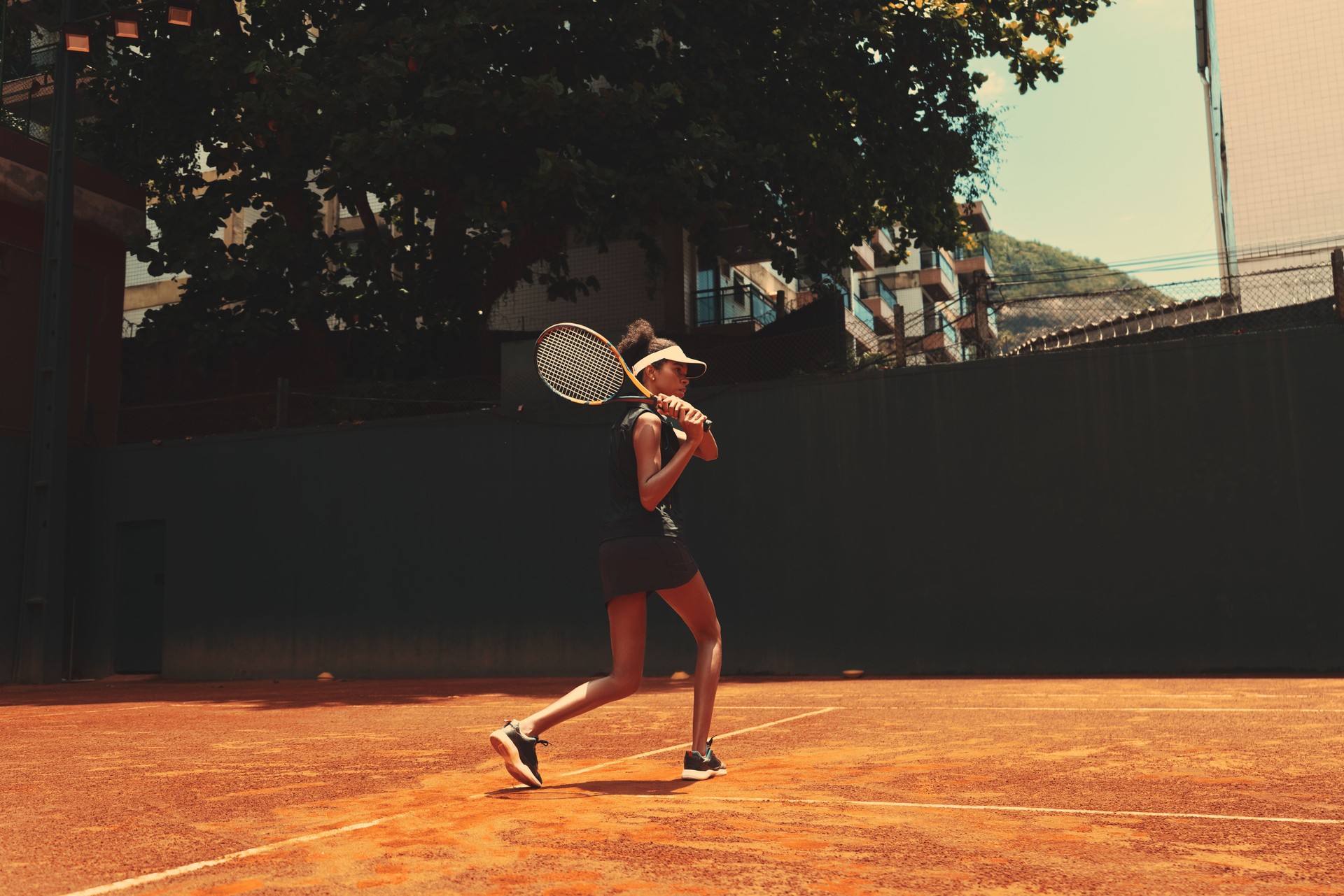 A young female tennis player, court