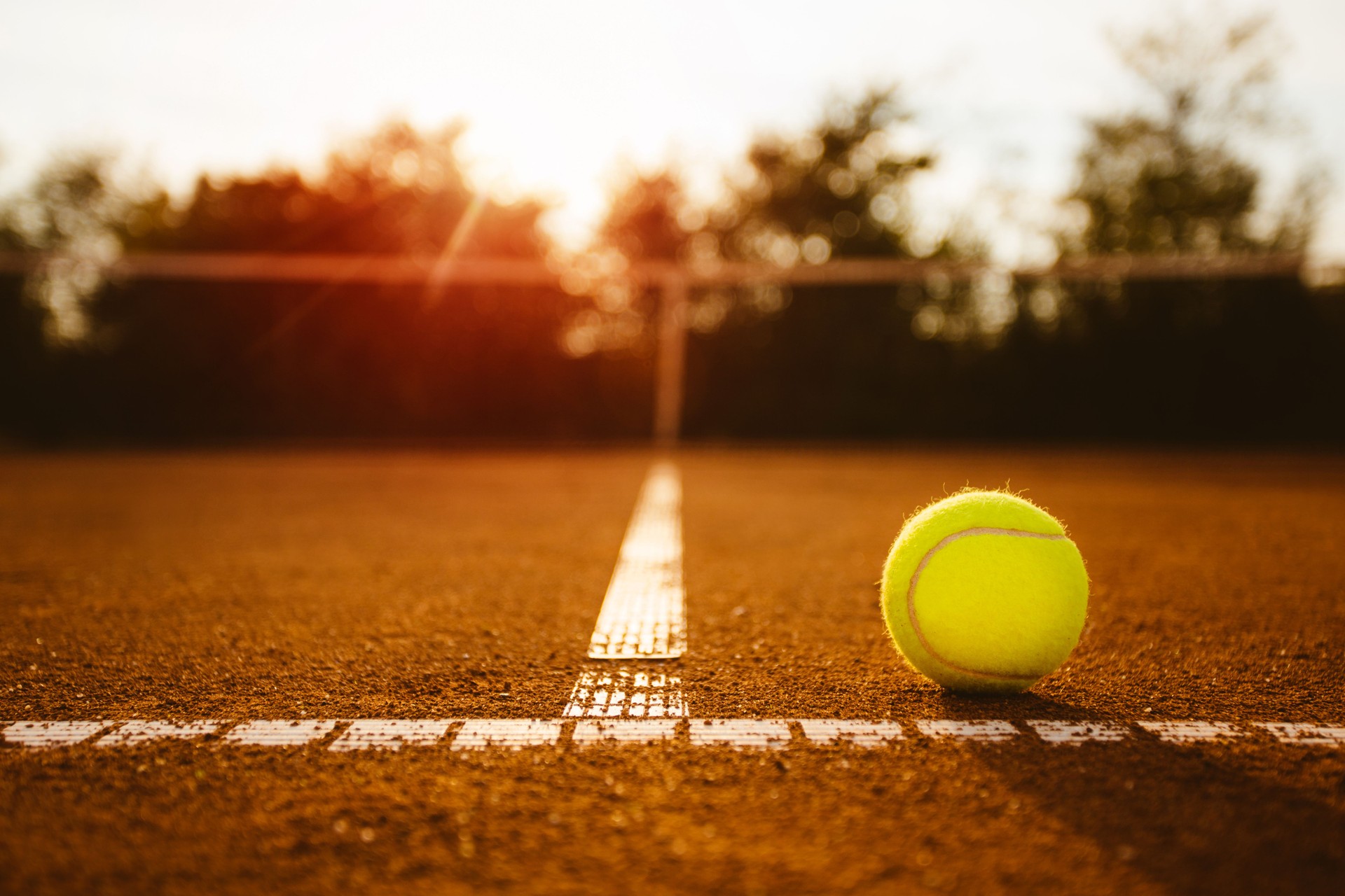 Tennis ball on clay court