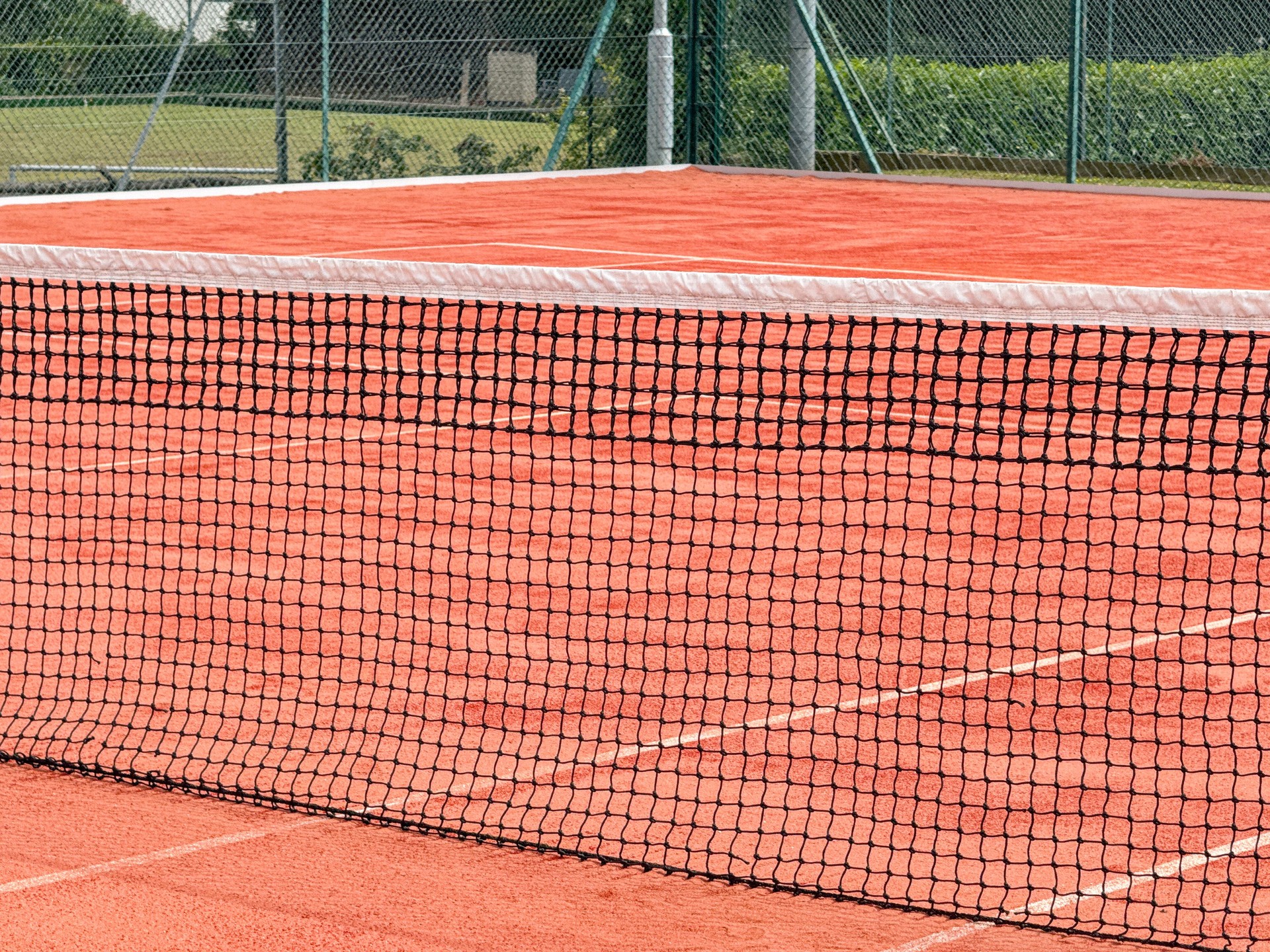 Close up view of  the net on a tennis court
